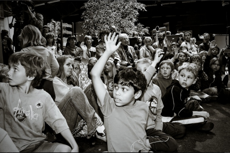 kids raising their hands